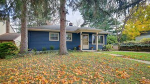 A house with a blue exterior, a front door, and a small porch area. - Ann Arbor Home w/ Deck, 2 Mi to Michigan Stadium! (Ann Arbor)