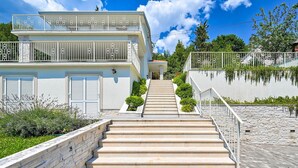 A two-story building with a central staircase leading to a balcony. - Awesome home in Opatija (Opatija)