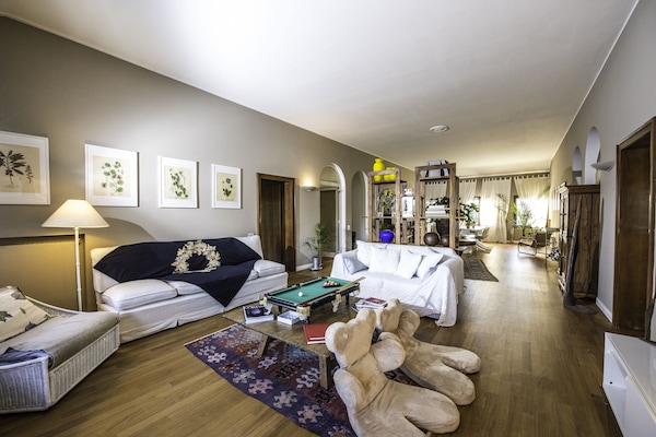 Spacious living room that connects all 3 rooms, there is also a kitchenette.