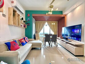 Comfort Apartment, 3 Bedrooms | Living area | 42-inch Smart TV with cable channels, Netflix, streaming services