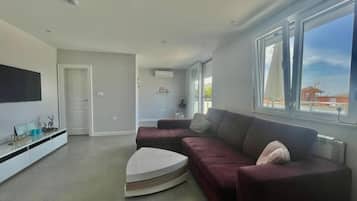 Family Apartment | Living area | 32-inch LCD TV with cable channels