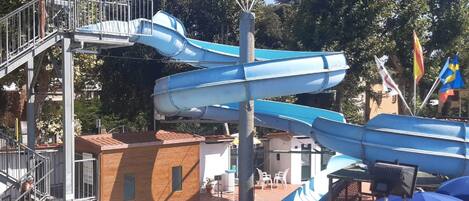 A water park with multiple slides and a lifebuoy.