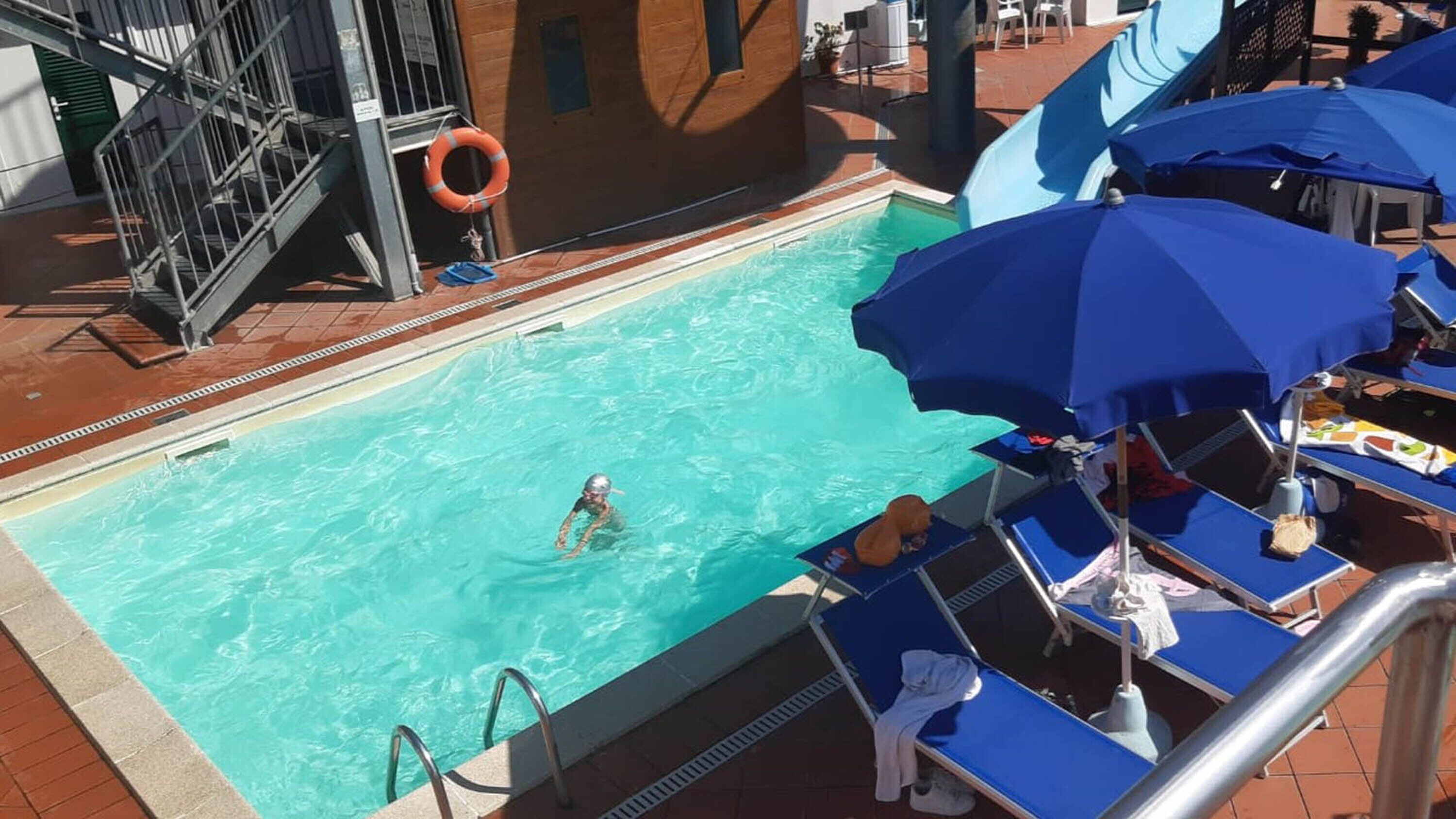 Seasonal outdoor pool, pool umbrellas, sun loungers