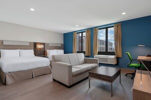 Suite, 2 Queen Beds | Desk, laptop workspace, iron/ironing board, free WiFi