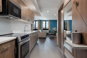 Suite, 2 Queen Beds | Desk, laptop workspace, iron/ironing board, free WiFi