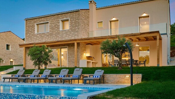 A modern two-story house with a swimming pool, outdoor seating, and a well-maintained lawn. - Villa Sauvignon (Motovun)