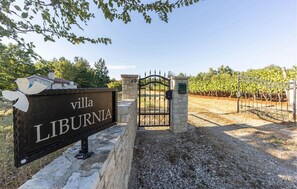 Enter a rustic retreat surrounded by a vineyard.