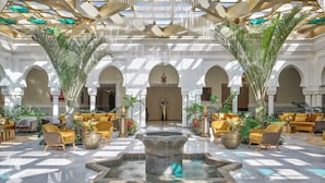 A spacious lobby with a central fountain, seating areas, and a high ceiling with natural light. - Four Seasons Hotel Rabat At Kasr Al Bahr (Rabat)