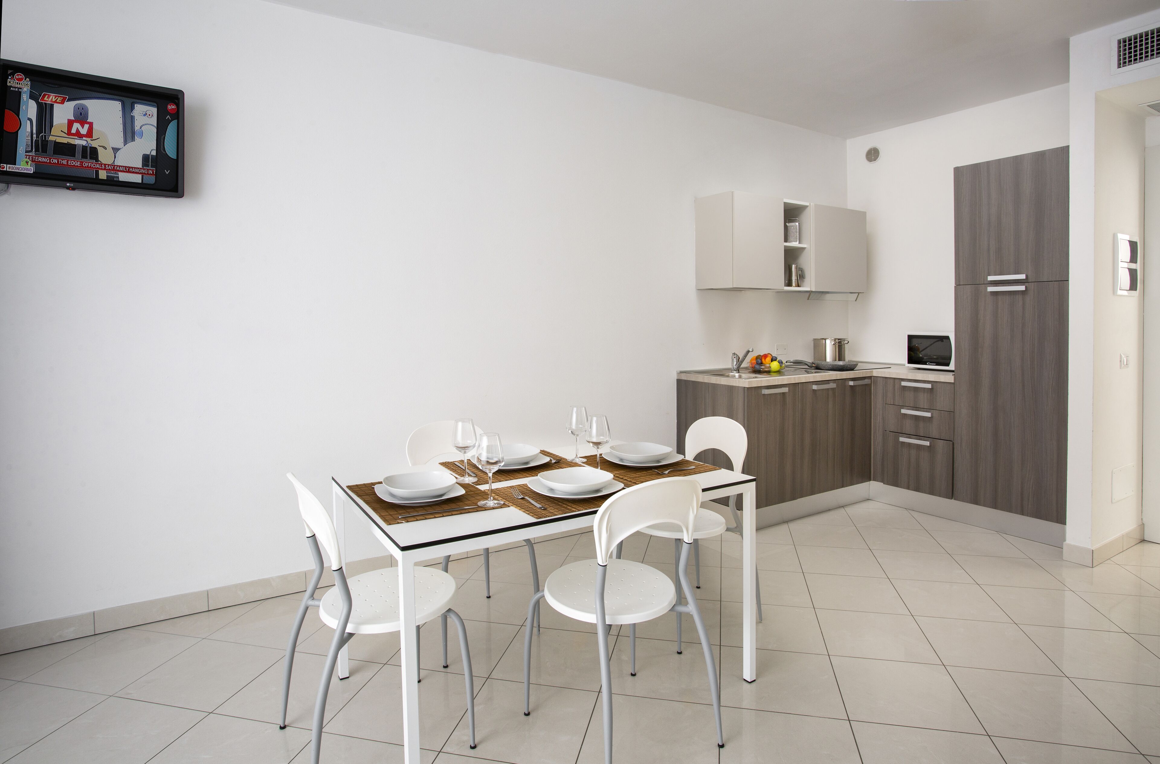 A modern kitchen with a dining area.
