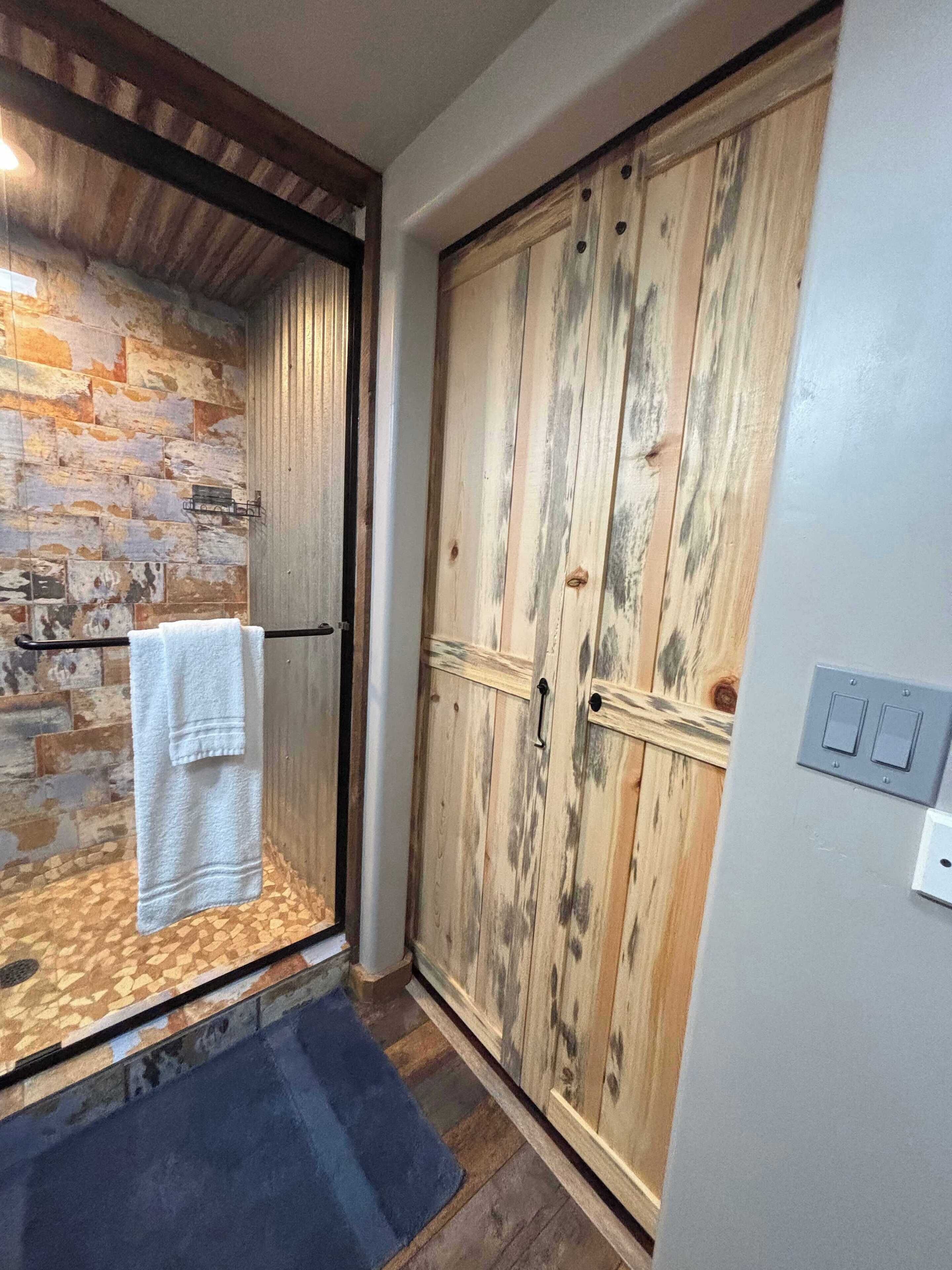 Shower, hair dryer, towels, toilet paper