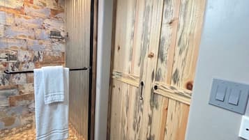 Shower, hair dryer, towels, toilet paper