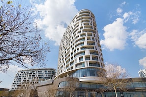 A modern high-rise building with multiple balconies and large windows. - Ellipse Waterfall 31002 (Midrand)