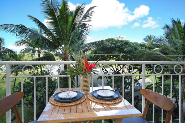 Outdoor dining - Just steps to beach! Gorgeous renovated park view condo at Waikiki Shore! (Honolulu)