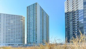 Three high-rise buildings with a clear sky.