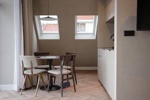 Deluxe Suite | Living area | 32-inch Smart TV with digital channels, Netflix, streaming services - By Friso (The Hague)