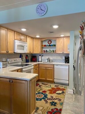 Fridge, microwave, oven, stovetop - OCEAN FRONT CONDO. ENJOY YOUR MORNING COFFEE SITTING ON YOUR PRIVATE BALCONY WATCHING THE SUNRISE. (Rehoboth Beach)