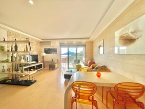 Comfort Apartment | Living area | 32-inch LCD TV with cable channels