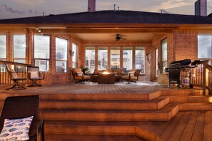 A covered patio with outdoor seating, a grill, and a fire pit. - The Views are for Miles! (San Antonio)