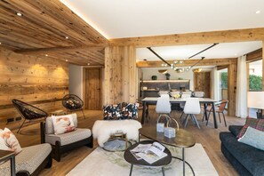 Cozy living area with a dining space, sofa, and coffee table.