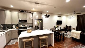 Fridge, coffee/tea maker, cookware/dishes/utensils