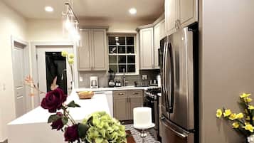 Fridge, coffee/tea maker, cookware/dishes/utensils