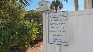 A sign indicating a private beach with access limited to specific locations. - Pool Views, Minutes to Beach, Ground Floor Unit + Free Attraction Tickets! (Santa Rosa Beach)