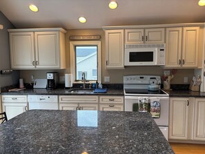 Fridge, stovetop, coffee/tea maker