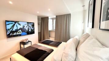 2 habitaciones, tabla de planchar con plancha, wifi y ropa de cama