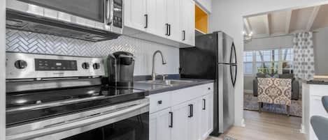 Fridge, microwave, coffee/tea maker, toaster