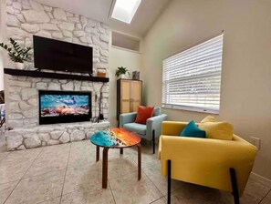 Smart TV, fireplace, books
