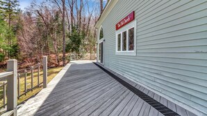 A building with a sign reading 'The Old Church' and a wooden deck. - Stratton; 6 min. King beds. Pool Table. Wood Stove. Dog friendly (Jamaica)