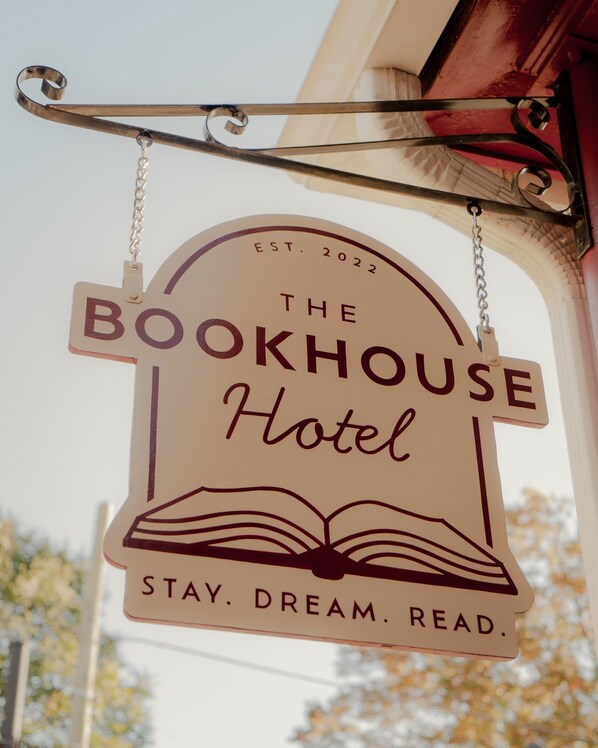 A sign for The Bookhouse Hotel with the text "EST. 2022" and "STAY. DREAM. READ." - The Bookhouse Hotel (Kennett Square)