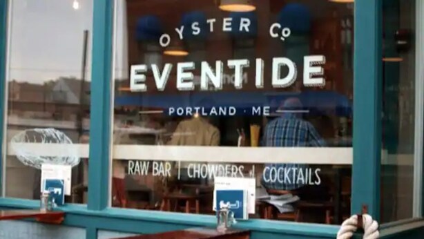 A restaurant window with 'OYSTER CO. EVENTIDE' signage, indicating a raw bar, chowders, and cocktails. - Modern & Sunny House Steps from the Promenade. Private Parking! (Portland)
