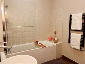 Shower, hair dryer, towels, soap