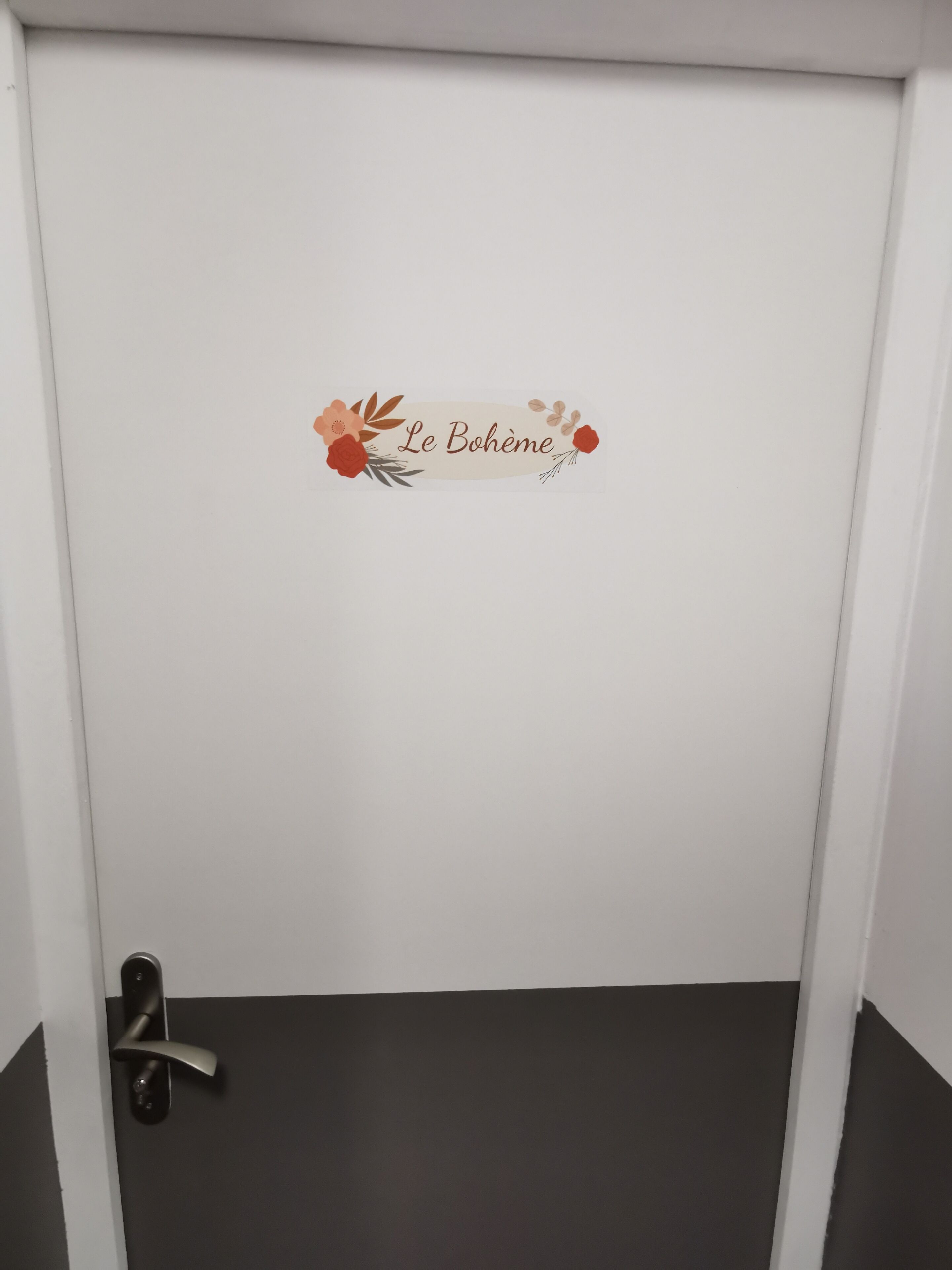 A door with a white frame and a dark floor.