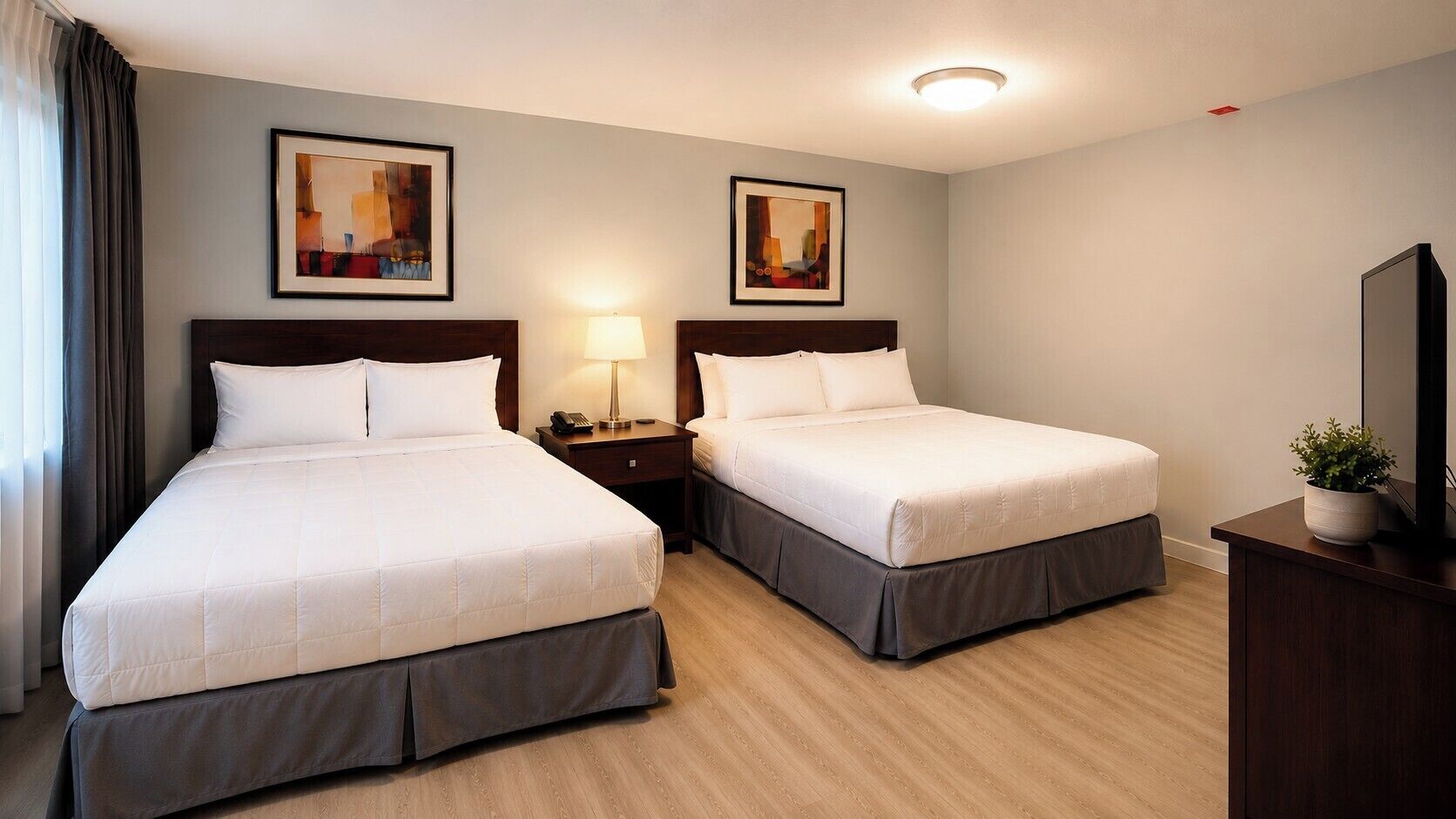 Economy Room | Minibar, desk, laptop workspace, iron/ironing board