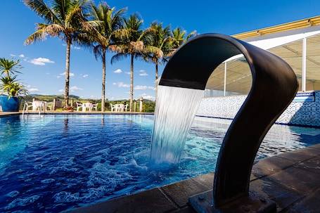 Indoor pool, outdoor pool, open 9:00 AM to 9:00 PM, pool umbrellas. Hotel Morro de Santo Agostinho