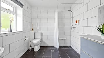 Shower, hair dryer, towels, soap