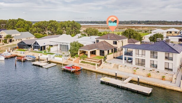 A coastal residential area with modern houses, a marina, and a view of the sea. - Waterfront Bliss: Serenity & Adventure Await! (Geographe)