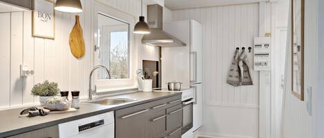 Fridge, stovetop, dishwasher, coffee/tea maker