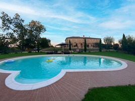 Seasonal outdoor pool, open 7:30 AM to 7:30 PM, pool umbrellas
