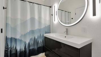 Shower, hair dryer, towels, shampoo