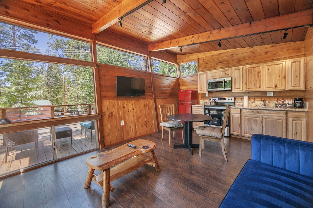 Executive Queen Cabin | Living area | 55-inch flat-screen TV with cable channels