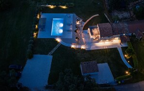 An aerial view of a property with a swimming pool, a patio area, and a separate building with a tiled roof. - Gorgeous home in Tinjan (Tinjan)