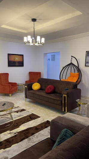 Living area - Experience unmatched luxury and comfort at our exquisite 3-bedroom apartment. (Abuja)
