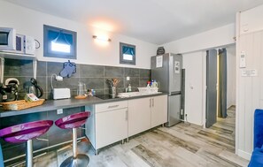 Fridge, microwave, stovetop, coffee/tea maker