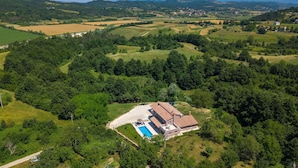 An aerial view of a property with a large house, a swimming pool, and surrounding greenery. - Awesome home in Pazin with sauna (Pazin)