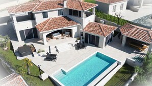 A modern two-story house with a swimming pool, outdoor seating, and a tiled roof. - Stunning home in Vizinada (Vizinada)