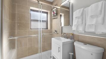 Shower, hair dryer, towels, soap
