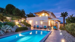 A modern house with a swimming pool, outdoor seating, and a stone staircase. - Lovely home in Opatija (Opatija)